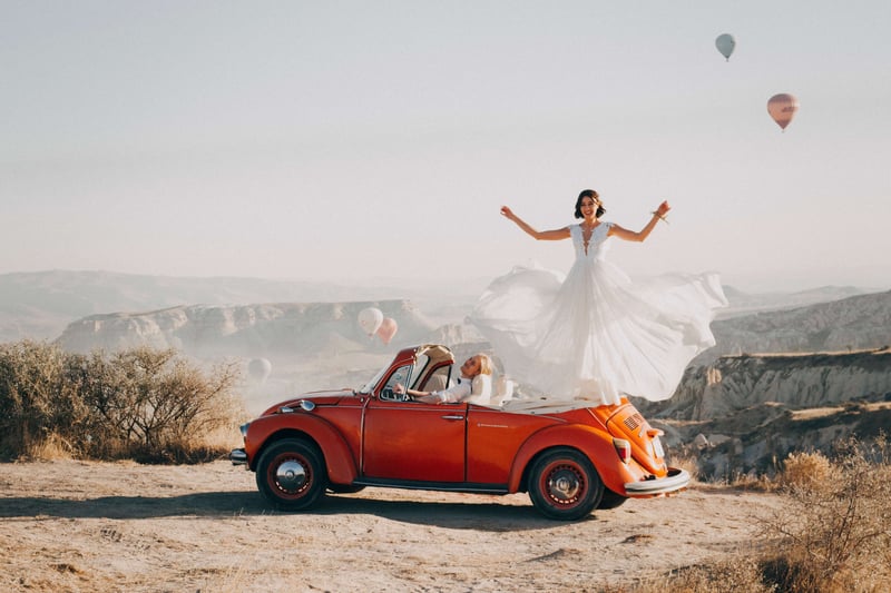 woman in dress on vehicle preparing for an event
